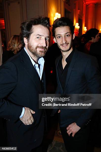 Actors Edouard Baer and Pierre Niney attend the 'Diner Des Producteurs' - Producer's Dinner Held at Hotel George V on February 16, 2015 in Paris,...