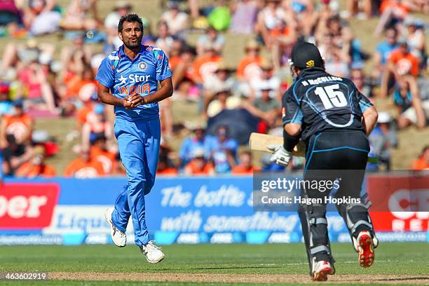 Mohammed Shami of India takes a catch off his own bowling to dismiss Nathan McCullum of New Zealand during the first One Day International match...