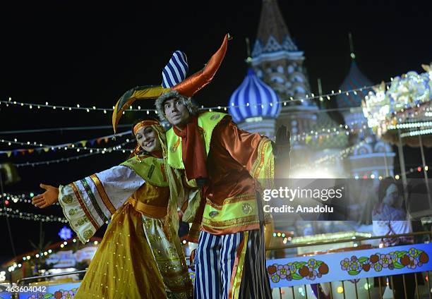 People dressed in costume pose for a picture during Maslenitsa Festival in Moscow, Russia on February 16, 2015. Maslenitsa Festival marks the coming...