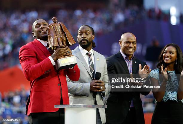 Walter Payton NFL Man of the Year Award winner Thomas Davis of the Carolina Panthers accepts his award on the field prior to Super Bowl XLIX between...