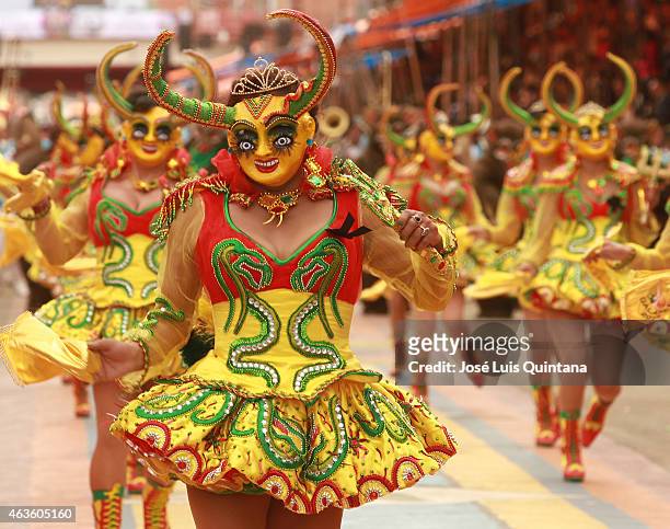 Performers disguised as Diabla Supay walk through 6 de Agosto Avenue during the traditional Entrada del Carnaval de Oruro on February 14, 2015 in...