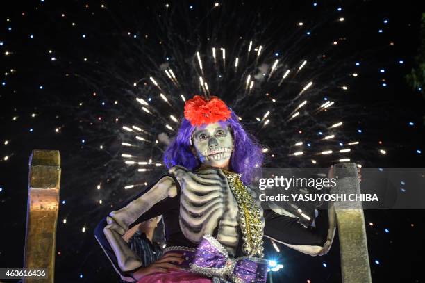 Reveler of the Sao Clemente samba school performs during the second night of carnival parade at the Sambodrome in Rio de Janeiro, Brazil on February...