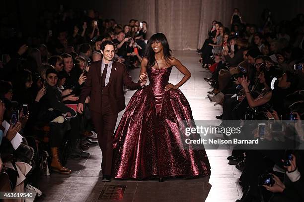 Zac Posen and Noami Campbell walk the runway at the Zac Posen fashion show during Mercedes-Benz Fashion Week Fall 2015 at Vanderbilt Hall at Grand...