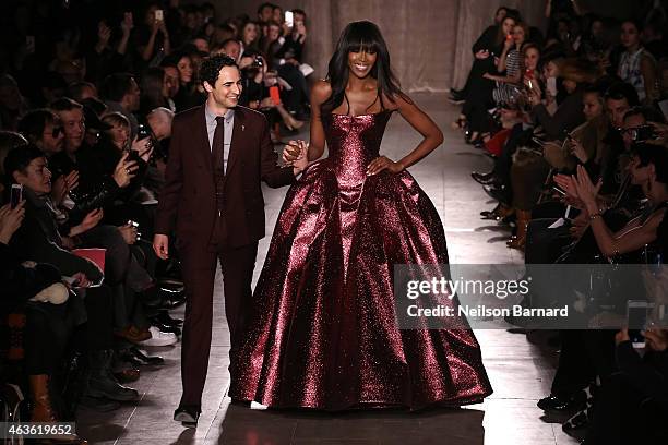 Zac Posen and Noami Campbell walk the runway at the Zac Posen fashion show during Mercedes-Benz Fashion Week Fall 2015 at Vanderbilt Hall at Grand...