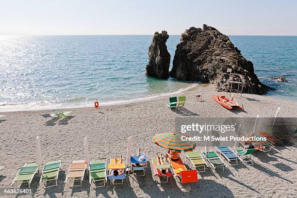 vacation italy - multi coloured umbrella stock pictures, royalty-free photos & images