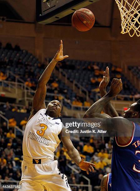 Juwan Staten of the West Virginia Mountaineers scores against the Kansas Jayhawks during the game at the WVU Coliseum on February 16, 2015 in...