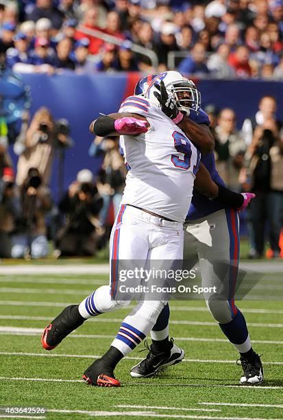 Spencer Johnson of the Buffalo Bills rushes up against Will Beatty of the New York Giants during an NFL football game at MetLife Stadium on October...