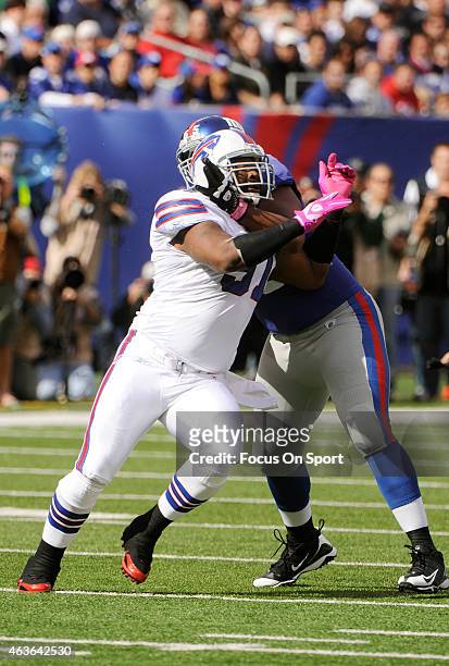 Spencer Johnson of the Buffalo Bills rushes up against Will Beatty of the New York Giants during an NFL football game at MetLife Stadium on October...