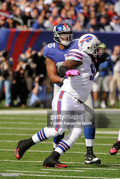 Spencer Johnson of the Buffalo Bills rushes up against Will Beatty of the New York Giants during an NFL football game at MetLife Stadium on October...