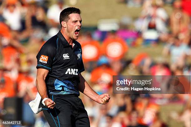 Mitchell McClenaghan of New Zealand celebrates after taking the wicket of Rohit Sharma of India during the first One Day International match between...