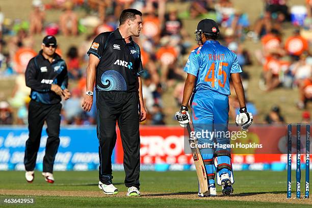 Mitchell McClenaghan of New Zealand exchanges words with Rohit Sharma of India during the first One Day International match between New Zealand and...
