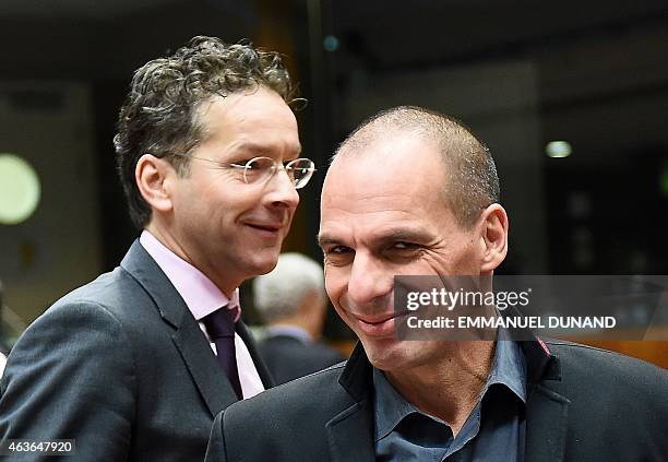 Greece's Finance Minister Yanis Varoufakis and Eurogroup President and Dutch Finance Minister Jeroen Dijsselbloem arrive to take part in a European...