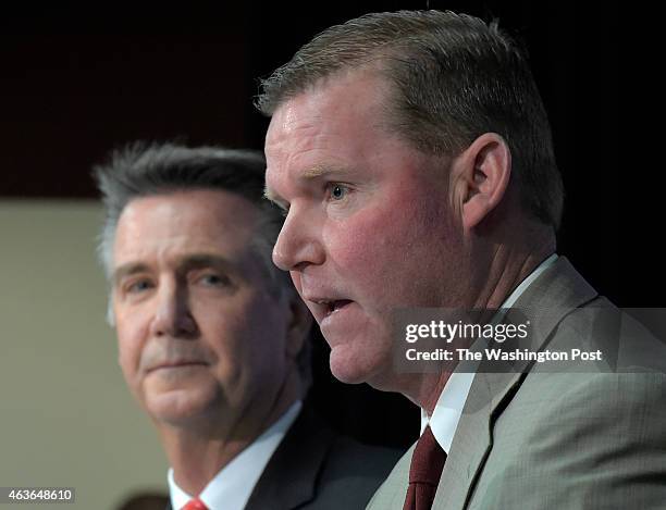 Redskins' team President Bruce Allen listens to Scot McCloughan as he is introduced as the Redskins new General Manager during press conference at...