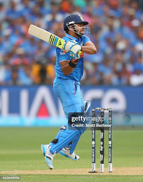 Suresh Raina of India hits a boundary during the 2015 ICC Cricket World Cup match between India and Pakistan at Adelaide Oval on February 15, 2015 in...