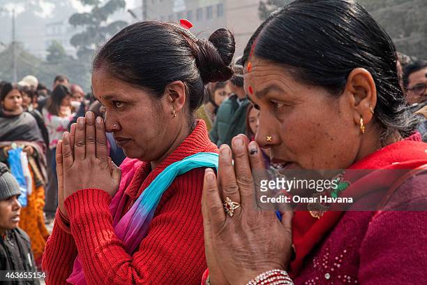 Devotees pray in front of the Pashupatinath temple during the celebration of the Maha Shivaratri festival on February 17, 2015 in Kathmandu, Nepal....
