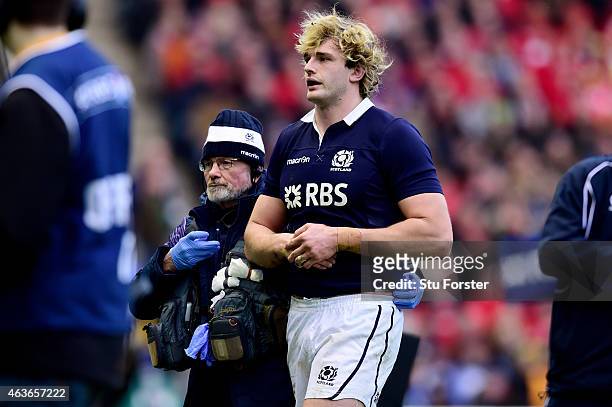 Lock Richie Gray of Scotland leaves the pitch due to an arm injury during the RBS Six Nations match between Scotland and Wales at Murrayfield Stadium...