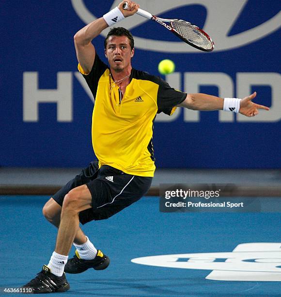 Marat Safin of Russia plays a return shot to Dominik Hrbaty of the Slovak Republic during the 2009 Hopman Cup day seven men's final match between...