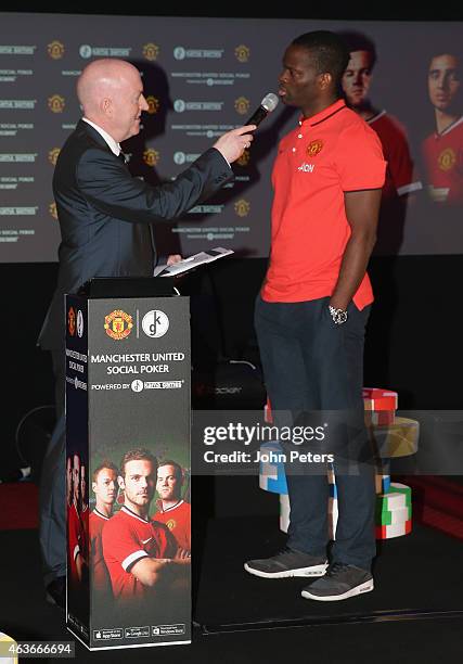 Former player Louis Saha of Manchester United is interviewed at a press conference to launch Manchester United's partnership with KamaGames and...