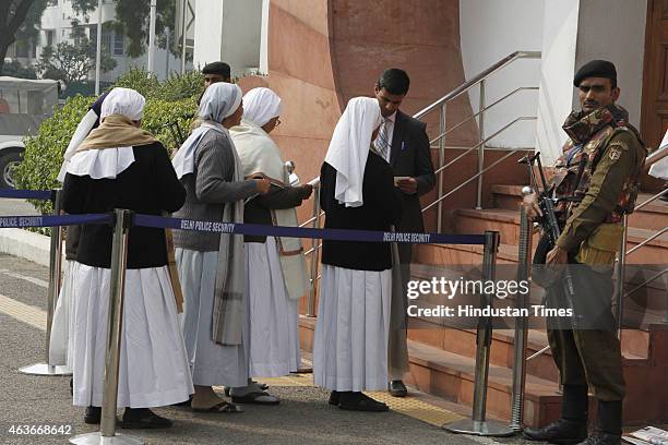 Nuns arrive for a function to celebrate the elevation of Kuriakose Elias Chavara and Mother Euphrasia to sainthood on February 17, 2015 in New Delhi,...