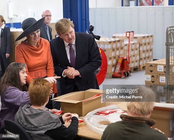 Queen Maxima of The Netherlands and King Willem-Alexander of The Netherlands visit the Wedeka social labour centre on February 17, 2015 in...
