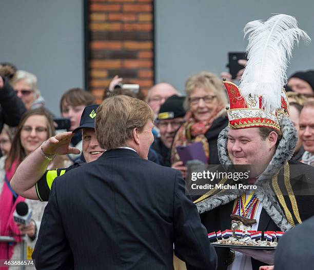 King Willem-Alexander of The Netherlands meets Prince Carnival before a visit to the multi functional venue De Deele on February 17, 2015 in Emmer...