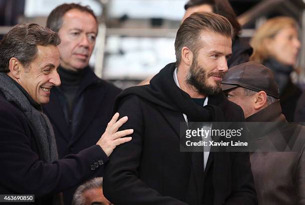 Nicolas Sarkozy and David Beckham attend the UEFA Champions League Round of 16 between Paris Saint-Germain and Chelsea at Parc Des Princes on...