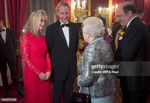Queen Elizabeth II meets Mike Rutherford and his wife Angie Rutherford at a reception to mark the 80th anniversary of Diabetes UK, at St James's...