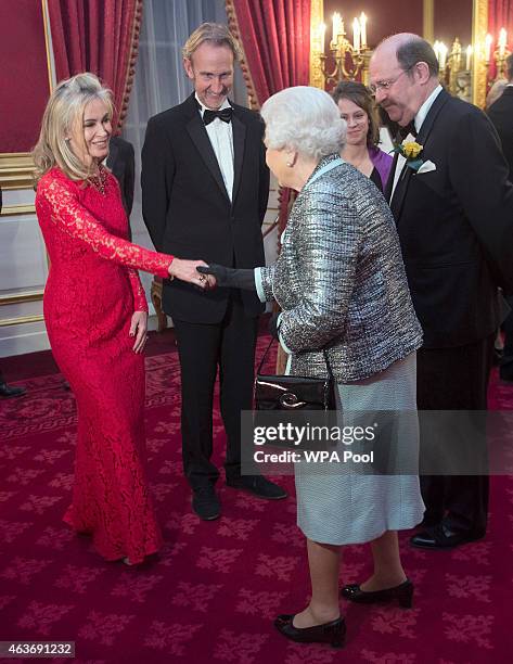 Queen Elizabeth II meets Mike Rutherford and his wife Angie Rutherford at a reception to mark the 80th anniversary of Diabetes UK, at St James's...