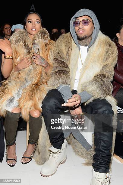 Karrueche Tran and Chris Brown attend the Michael Costello fashion show during Mercedes-Benz Fashion Week Fall 2015 at The Salon at Lincoln Center on...