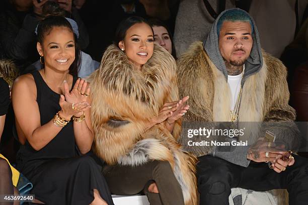 Christina Milian, Karrueche Tran, and Chris Brown attend the Michael Costello fashion show during Mercedes-Benz Fashion Week Fall 2015 at The Salon...