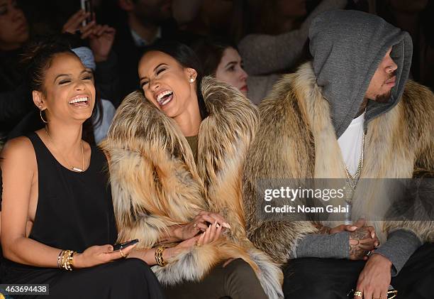 Christina Milian, Karrueche Tran, and Chris Brown attend the Michael Costello fashion show during Mercedes-Benz Fashion Week Fall 2015 at The Salon...