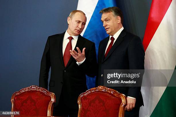 Russian President Vladimir Putin and Hungarian Prime Minister Viktor Orban hold a joint press conference after their meeting at Parliament on...