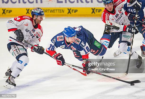 Kai Hospelt of the Adler Mannheim falls on the floor against Andre Rankel of the Eisbaeren Berlin during the game between Adler Mannheim and...