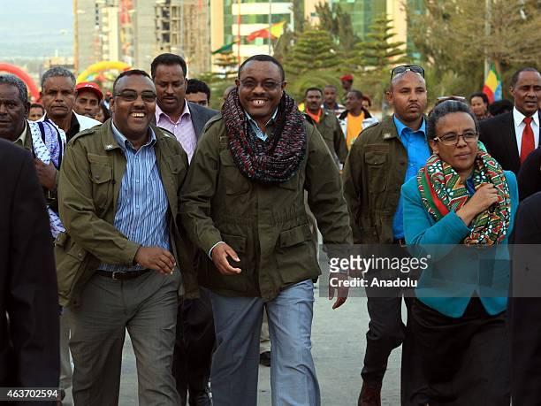 Ethiopia's Prime Minister Hailemariam Desalegn , his wife Roman Tesfaye and Tigray Region President Abay Woldu walk to Martyr's Memorial Monument on...