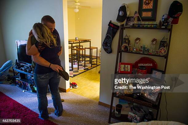 Amber Wise and her husband, Marine Cpl. Beau Wise hug each other at their military base home on February 4, 2013 in Silverdale, Wa. Jean and Mary...