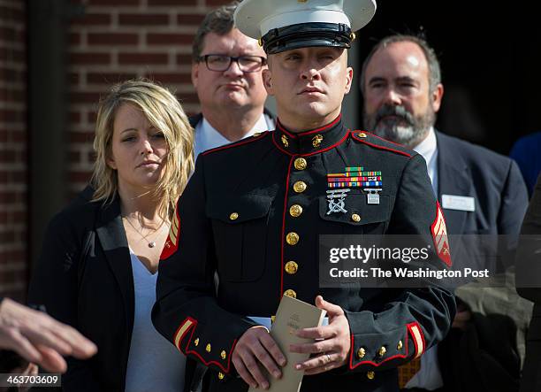 Marine Cpl. Beau Wise, center in uniform, with his wife Amber Wise, arrive for a ceremony dedicating the Young-Wise Memorial Stadium at Hendrix...