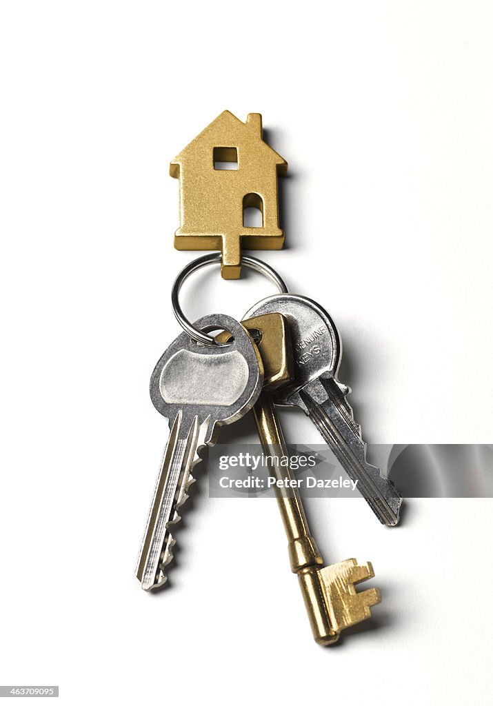Close-up of house keys on white background