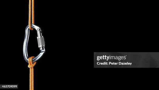 orange climbing rope connected by karabiner - mousqueton photos et images de collection