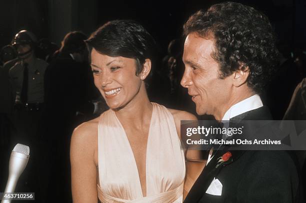 Actor Joel Grey and wife Jo Wilder arrive at the Academy Awards on March 27, 1973 at the Dorothy Chandler Pavilion in Los Angeles, California.