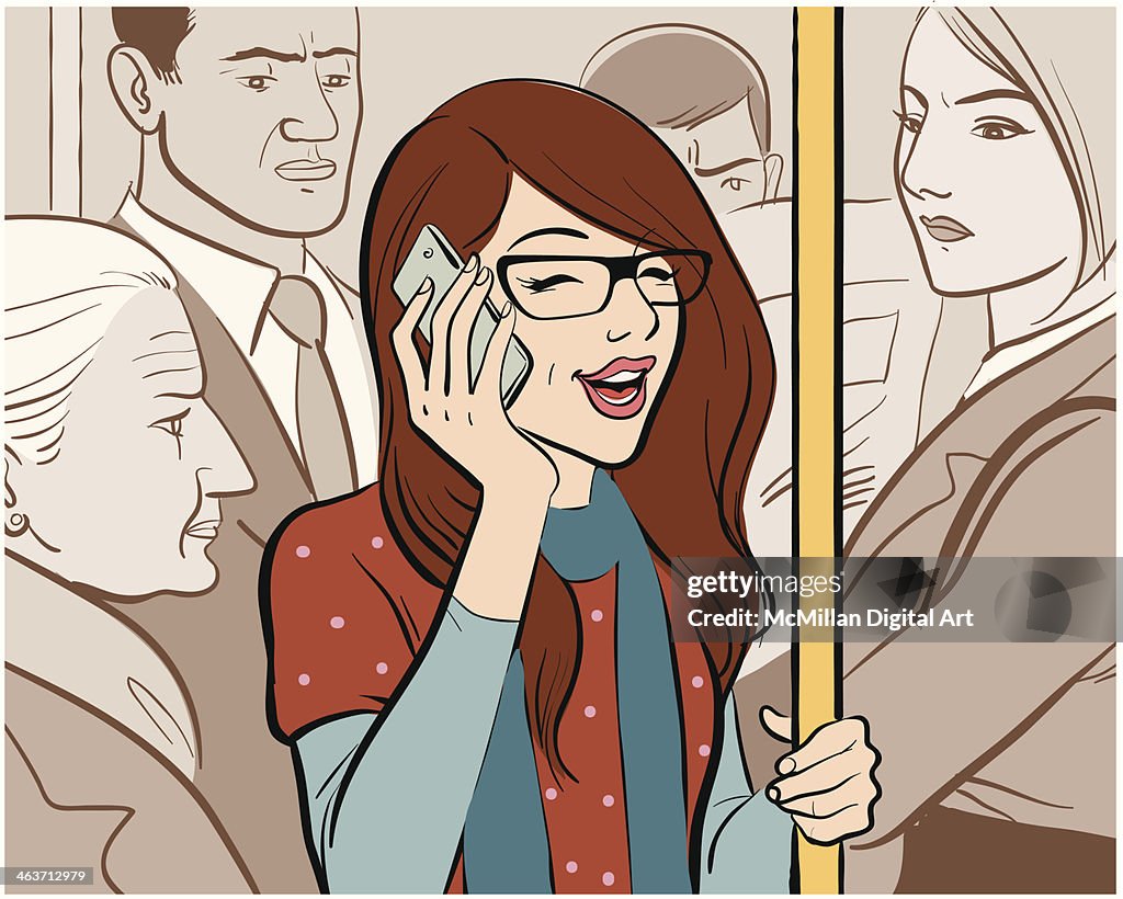 Woman talking on cell phone on train