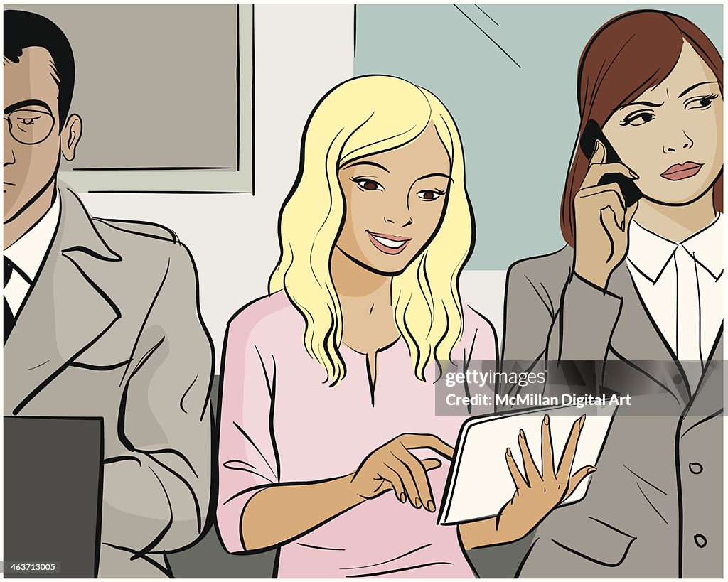 Woman using digital tablet on train