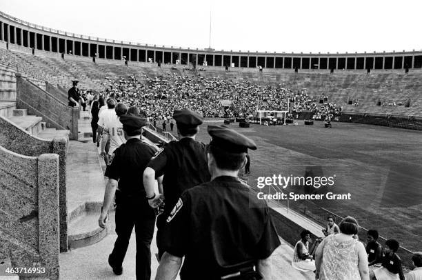 Police at Joan Baez concert at Harvard Stadium, Brighton, Massachusetts, 1969.