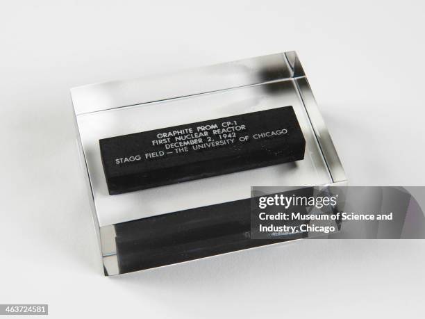 An image of a commemorative graphite section sealed in acrylic saved from the world's first self sustained nuclear reaction engineered by physicist...