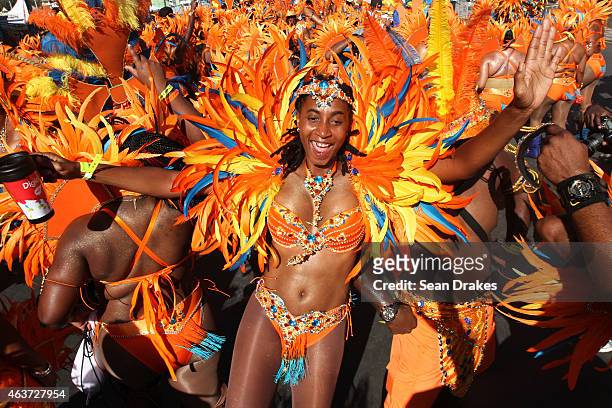 Masqueraders from the band 'Ah Come Back Home' by Ronnie & Caro dance in the Queen's Park Savannah during the Parade of Bands as part of Trinidad and...