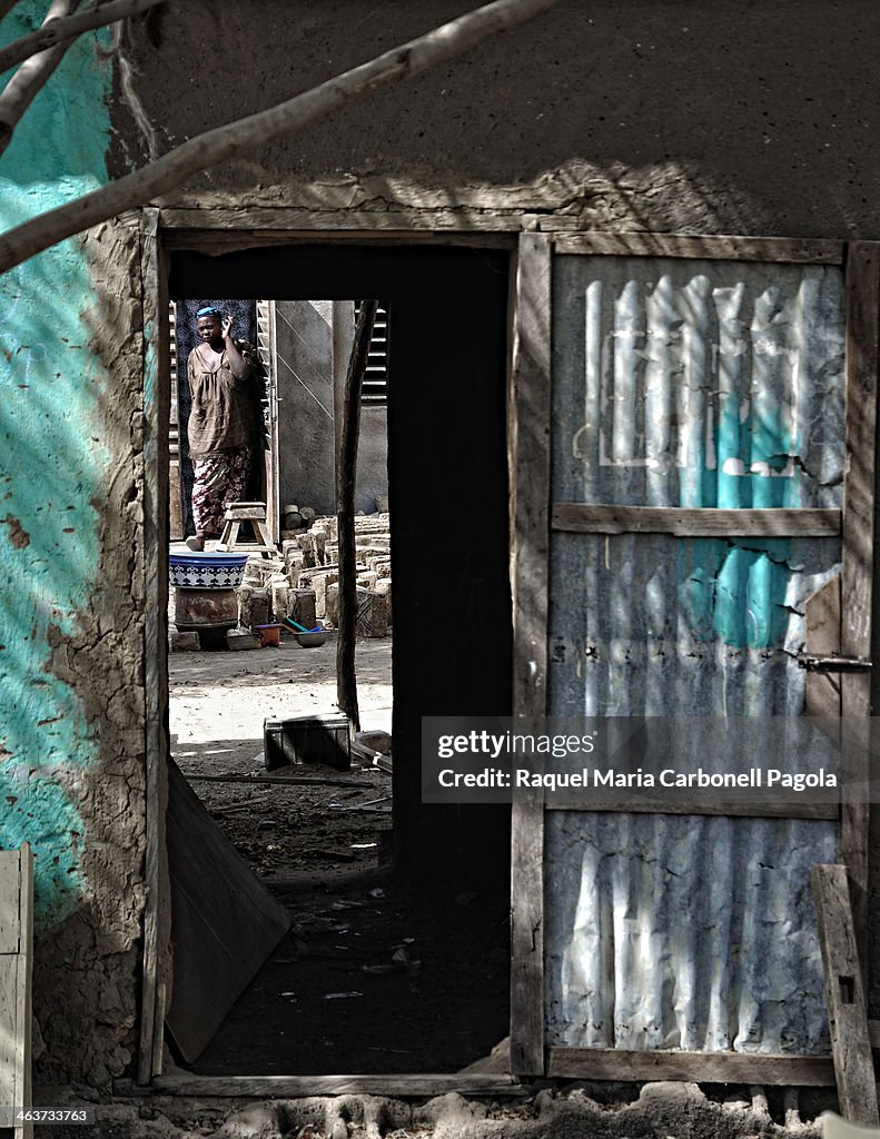 Woman in her house´s inner courtyard...