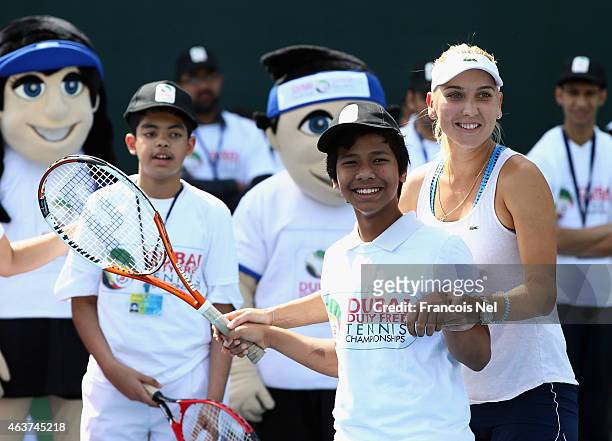 Elena Vesnina of Russia takes part in a special needs coaching clinic during day four of the WTA Dubai Duty Free Tennis Championship at the Dubai...