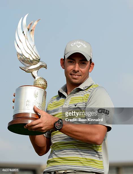 Pablo Larrazabal of Spain with the winners trophy after winning the tournament during the final round of the Abu Dhabi HSBC Golf Championship at the...