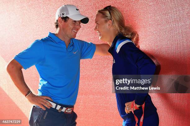 Rory McIlroy of Northern Ireland talks to his fiance Caroline Wozniacki of Denmark, after coming joint second after the final round of the Abu Dhabi...