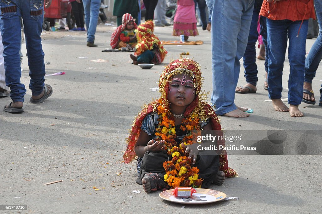 A female Indian street child dressed as a Kanjak,  a Hindu...