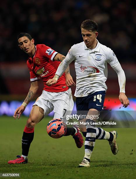 Angel Di Maria of Manchester United in action with Joe Garner of Preston North End during the FA Cup Fifth round match between Preston North End and...
